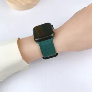 Dark green magnetic silicone replacement watch band compatible with Apple Watch series.