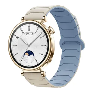 Smartwatch with gold case and dual-color magnetic silicone strap, stylish digital dial.