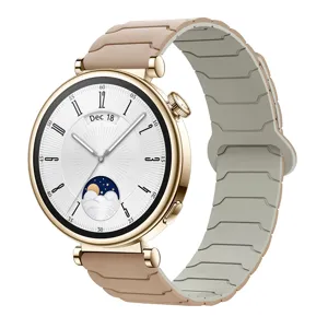 Luxury gold case smartwatch featuring nude silicone magnetic strap and stylish moon phase watch dial.