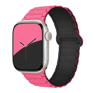 Detailed close-up of the pink and black magnetic silicone watch strap showing texture.
