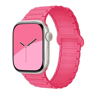 Pink silicone magnetic watch band compatible with Apple Watch, soft replacement wrist strap.