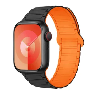 Silicone magnetic watch band replacement compatible with Apple Watch, black and orange style.