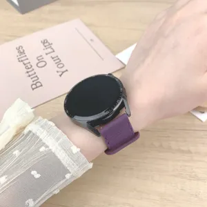 Replacement silicone watch strap for smartwatches, flexible and comfortable purple band.