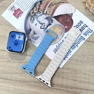 Silicone magnetic watch strap detail, featuring cute paw print design and secure clasp.