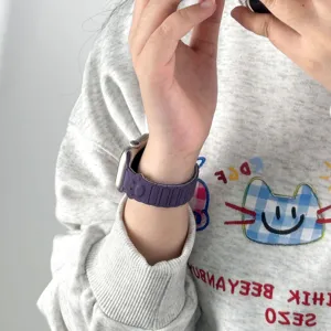 Purple silicone magnetic watch strap for Apple Watch, stylish dog paw design, comfortable daily wear.