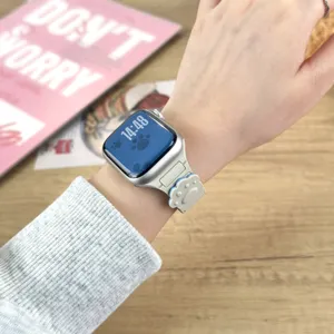Close-up detail of beige silicone watch strap with cute paw print design for smartwatches.