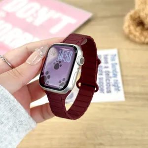 Silicone magnetic watch strap compatible with Apple Watch, stylish ripple design in maroon color.