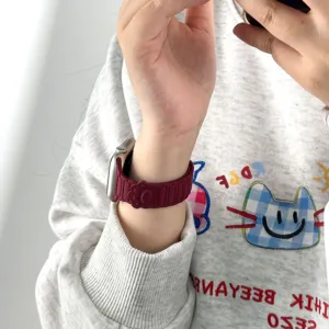 Silicone magnetic watch band compatible with Apple Watch, featuring cute paw print design.