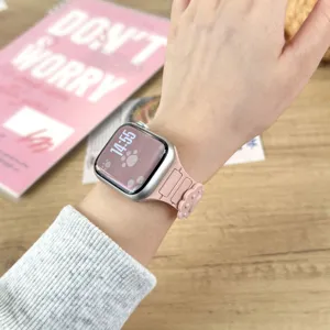 Detail view of the pink silicone watch strap with cute paw design for apple watch.