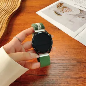Green striped nylon woven watch strap with magnetic folding clasp, comfortable and durable accessory.