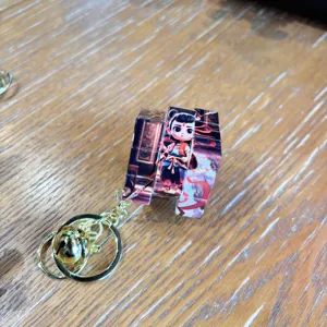 Nezha cartoon magic cube keychain pendant, cute puzzle bag accessory for students.