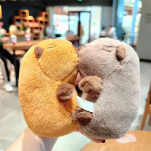 Close-up detail shot of cute capybara plush toys, soft and fluffy texture in dual colors.