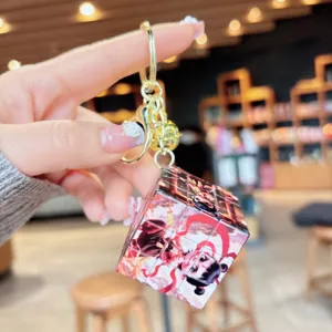 Miniature cartoon Nezha Rubik's cube keychain detail shot, creative student bag pendant.