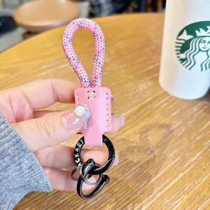 Rosa geflochtene Seil-Schlüsselanhänger mit PU-Leder und schwarzer Metall-Hufeisenschließe.