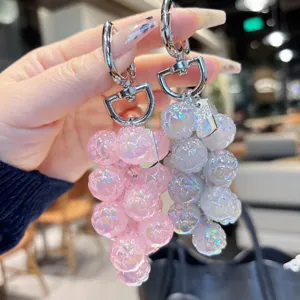 Detailed shot of the sparkling acrylic grape cluster keychain, showing delicate texture and hardware.