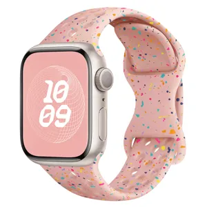 Bracelet de sport en silicone rose pour montre connectée avec pois colorés et trous respirants.