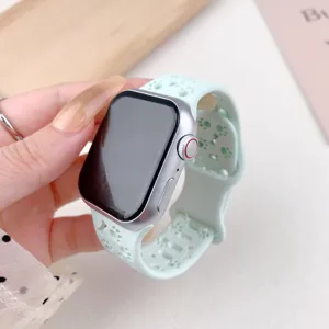 Mint green silicone watch strap with hollow paw print design for smart watch replacement.