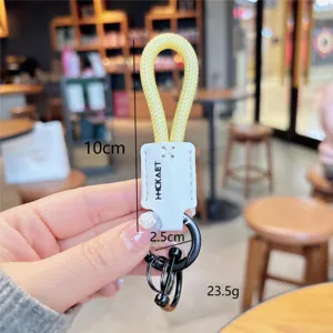 Geflochtener PU-Leder Schlüsselanhänger mit Hufeisenschnalle und Metallringen, stylisch.