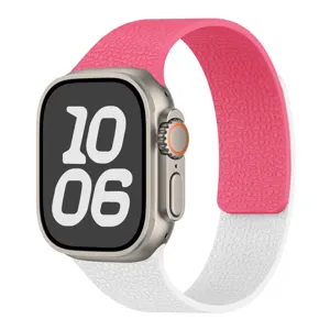 Silicone watch strap detail view, dual-color lychee pattern design, soft magnetic closure.