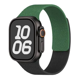 Detail view of magnetic silicone watch band in green and black contrast litchi pattern.
