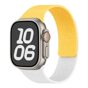 Detailed view of the yellow and white contrast lychee pattern silicone magnetic watch strap.