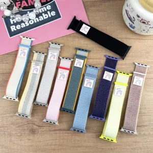 Detailed shot of colorful nylon loop watch bands for Apple Watch with cute woven rabbit tags.