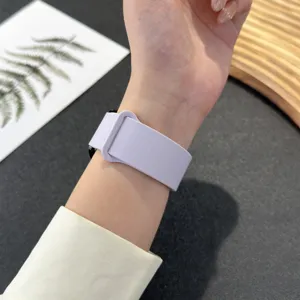 Close-up of a soft silicone magnetic watch band worn on wrist, showing flexible texture detail.