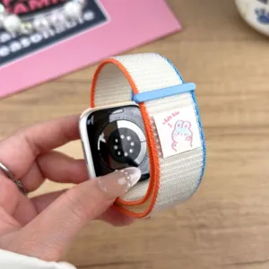 Detailed close-up of nylon loop watch strap featuring cute bunny woven tag and Velcro closure.