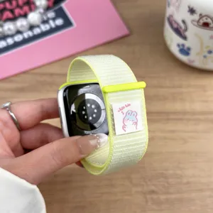 Nylon loop replacement watch band for smartwatches, vibrant yellow with cute rabbit label.
