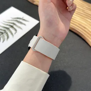Detailed view of white magnetic silicone smartwatch replacement strap, flexible and durable fit.