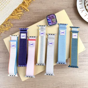 Nylon loop watch band compatible with Apple Watch, colorful woven bow strap accessory.