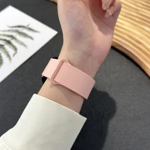 Pink silicone magnetic watch strap compatible with smartwatches, comfortable daily wear band.