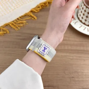 Detailed view of nylon loop watch strap for Apple Watch with cute embroidered bow design.