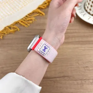 Pink nylon loop watch band compatible with Apple Watch, featuring a cute bow embroidery design.