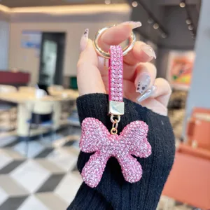 Pink rhinestone bow keychain bag charm, sparkling crystal car key ring for women fashion.