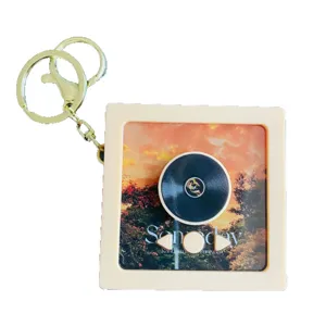 Mini creative music player keychain, cute record box pendant, portable fashion accessory.