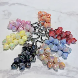 Acrylic flower grape cluster keychain detail showing multiple colorful pearlescent bag pendants.