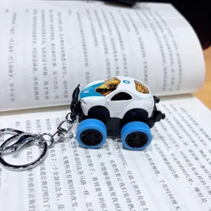 Alloy pull-back monster truck keychain detail view, mini car model bag pendant charm accessory.