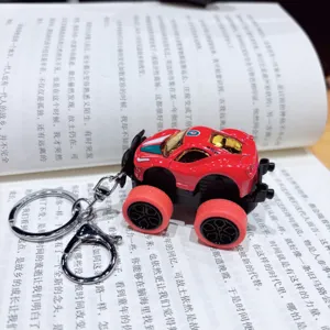 Alloy monster truck keychain, mini red car model pendant for trendy bags and keys. Perfect gift.