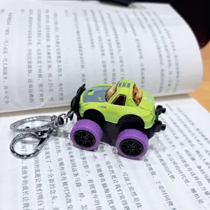 Detailed close-up view of the alloy pull-back monster truck keychain with lime green finish.