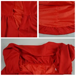 Red dress costume detail shot showing zipper stitching, hem and collar design features.