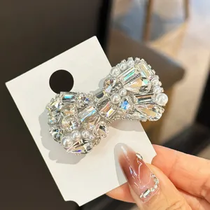 Elegant crystal bow hair clip, sparkling rhinestone duckbill side hair accessory for women.