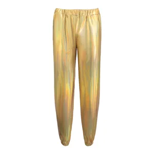 Gold holographic metallic detail view of shiny loose jogger pants fabric and elastic waist.
