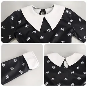 Kids black long sleeve dress with white collar and cuffs floral print costume details.