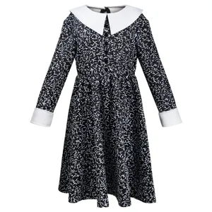 Close-up details of the gothic black long-sleeve kids dress with white collar and cuffs.