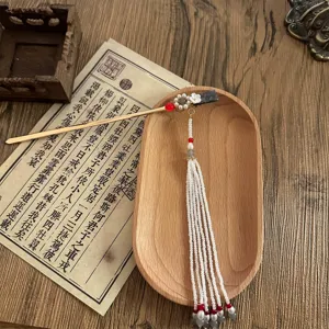 Traditional Chinese style hair stick with pearls and long tassels, perfect for Hanfu.
