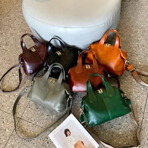Genuine leather dumpling crossbody bag for women, large capacity winter shoulder handbag.