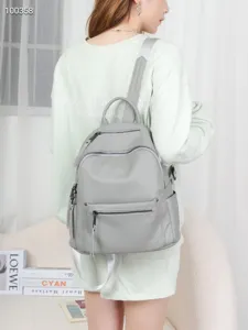 Women grey leather casual travel backpack with multi pockets and adjustable straps for daily use.