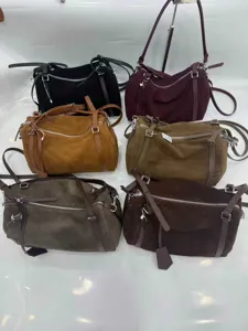 Detailed view of large capacity suede shoulder handbags, featuring multi-color options and zips.