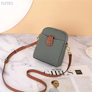 Genuine leather mini crossbody bag, grey phone bag with brown strap for casual daily wear.